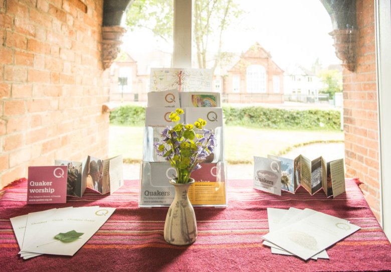 Meeting House display with brochures for Quaker worship event in Hall Green. - Banner