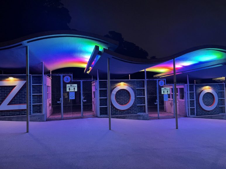 Vibrant entrance of Discovery Centre at Dudley Zoo, perfect for evening events. - Banner