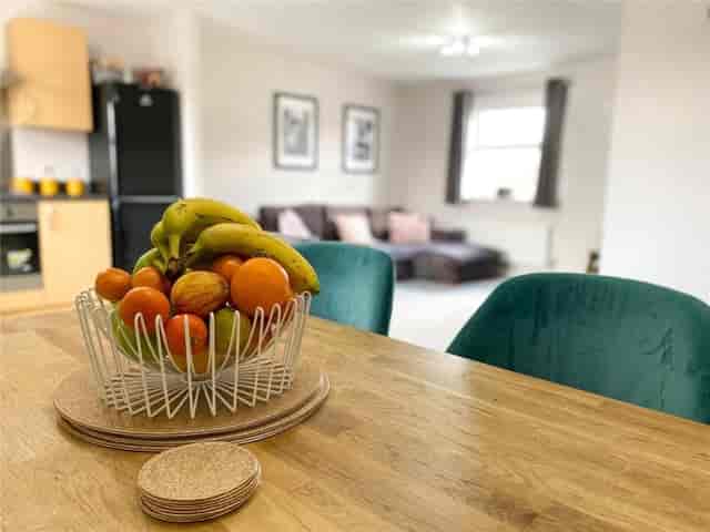 Cozy Evening Room at Brandwood Centre with fruit centerpiece for informal meetings.