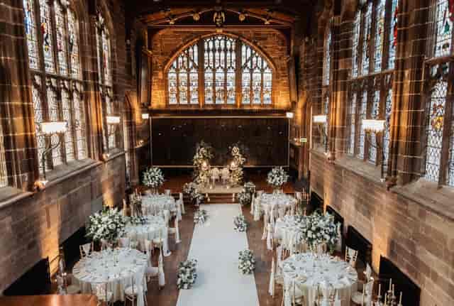 Luxury wedding ceremony setup in St Mary's Parish Church with elegant atmospheric lighting.