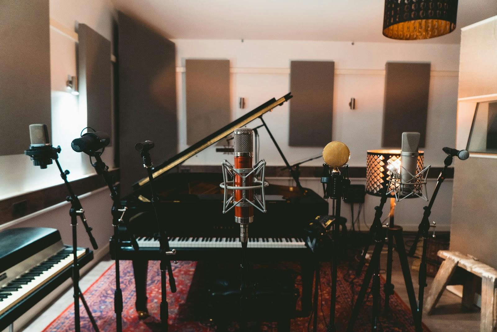 Recording studio with grand piano, ideal for music events and workshops. - Banner
