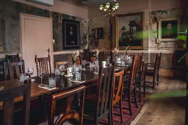 Rustic dining room at The Gallery, ideal for intimate gatherings and corporate meetings.