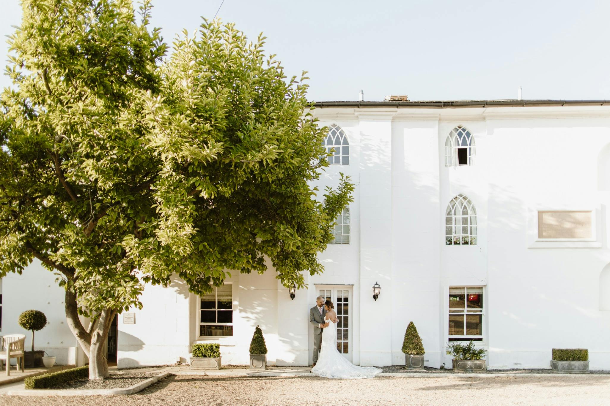 Outdoor gazebo at Warwick House, ideal for weddings and events with lush landscaping.
