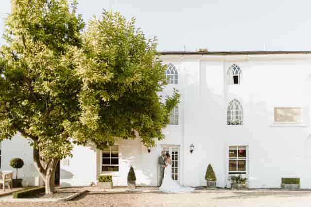 Outdoor gazebo at Warwick House, ideal for weddings and events with lush landscaping.