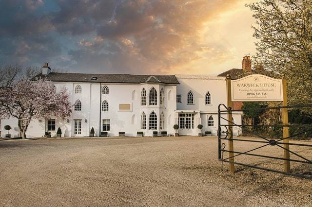 Outdoor gazebo at Warwick House, perfect for events and receptions in a scenic setting.