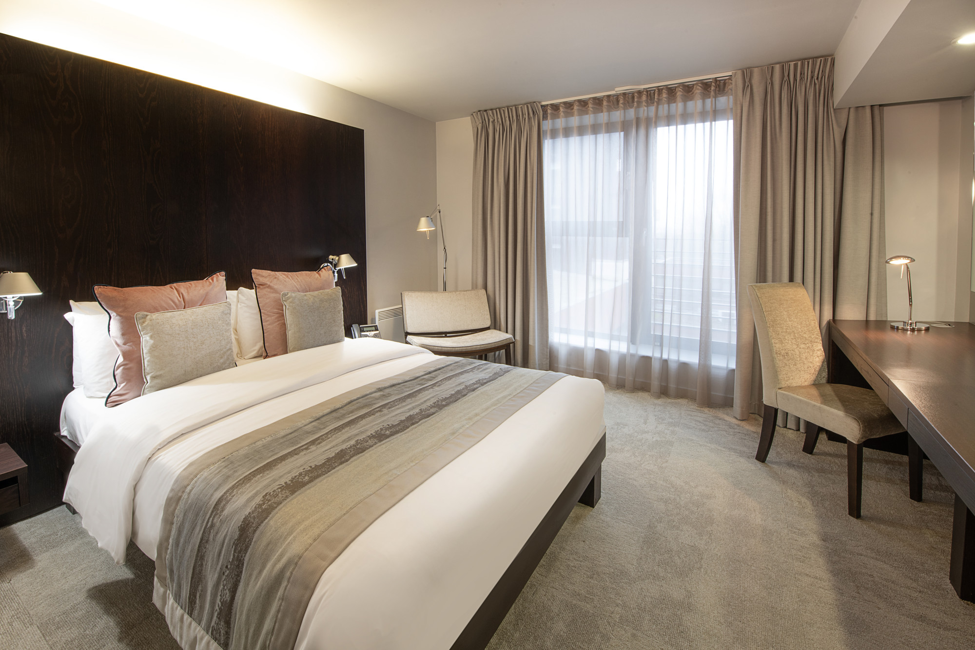 Modern hotel room in Conference Aston, ideal for business travelers at events. - Banner