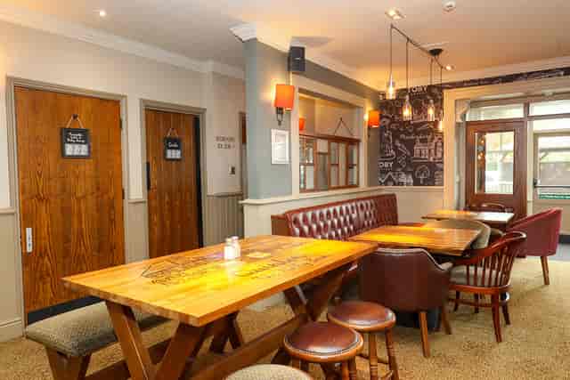Cozy meeting room with warm lighting at Toby Carvery Quinton for informal events.