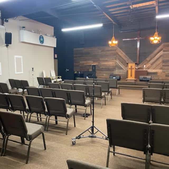 Versatile event space with wooden accents for meetings and community gatherings.