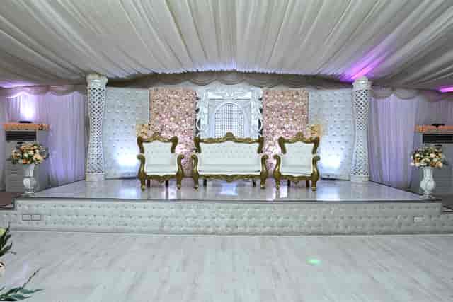 Elegant event stage with floral backdrop in Digbeth Hall, perfect for weddings and ceremonies.