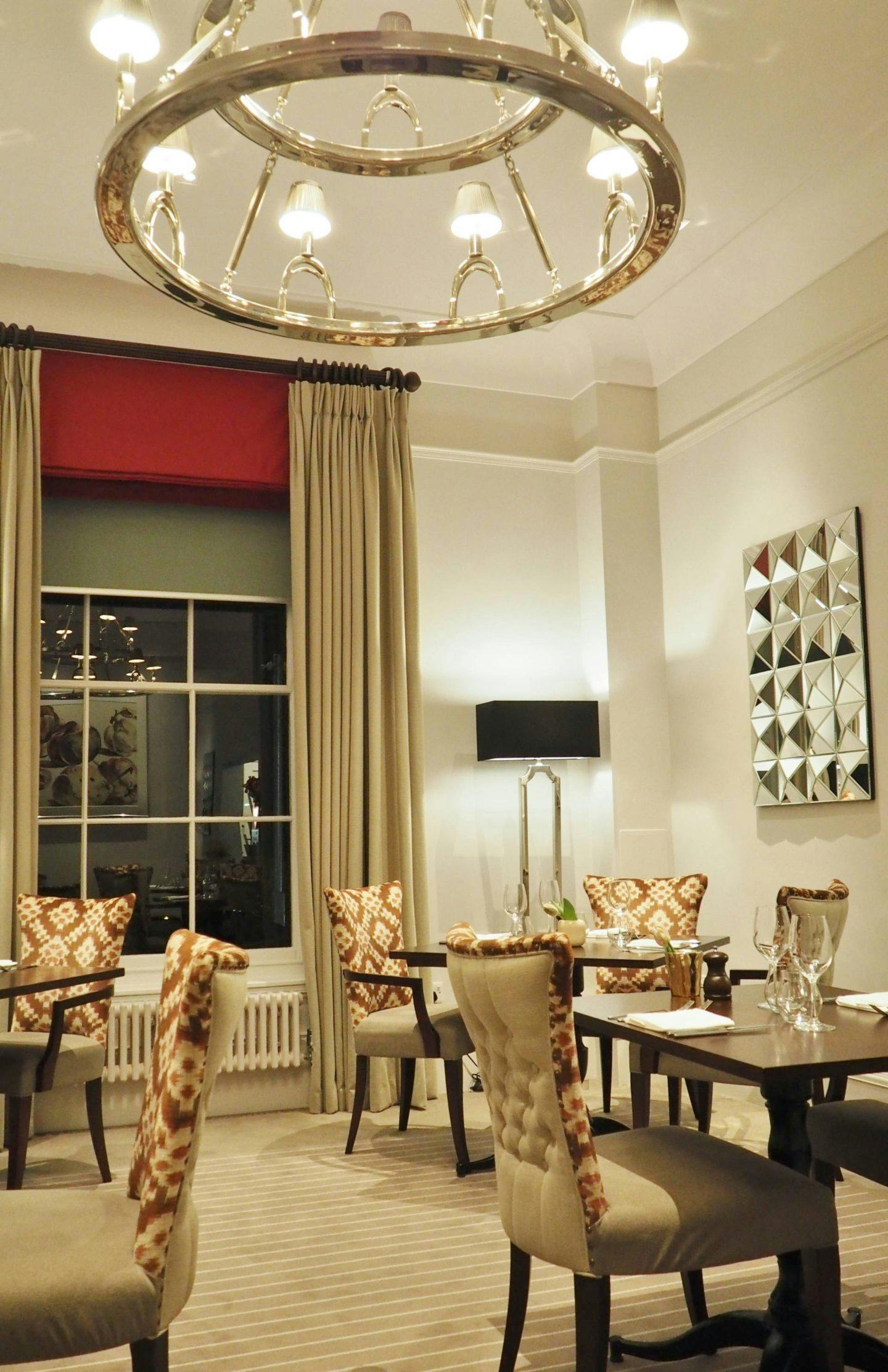 Private dining room at Three Church Road, featuring plush chairs for corporate meetings.