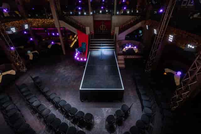 Stylish event space at Eight Embankment with central stage for fashion shows and presentations.