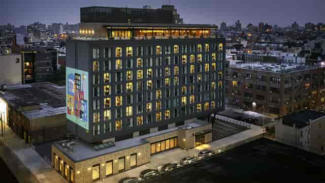 Modern hotel event space with vibrant art and natural light in The Hoxton, New York.