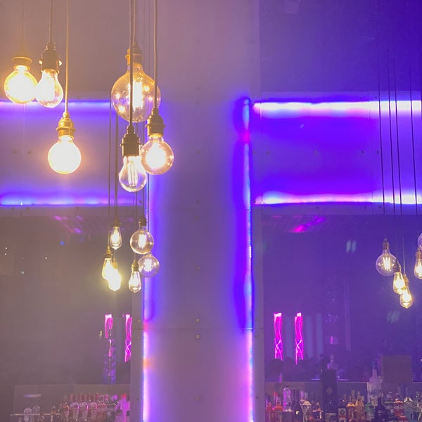 Vibrant Pryzm event space with purple lighting, perfect for networking and celebrations. - Banner