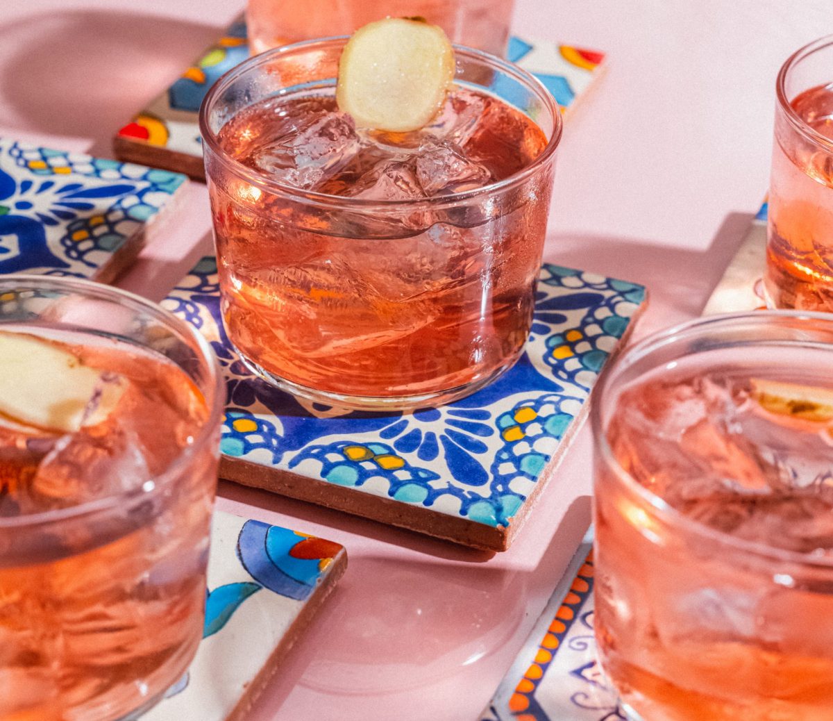 Vibrant cocktails on coasters at Hacha Brixton, perfect for social events and gatherings. - Banner