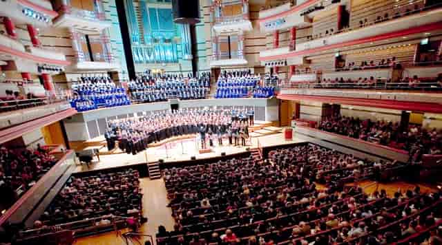Birmingham Town Hall concert hall with choir and orchestra, ideal for large events.