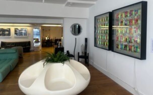 Modern meeting space in The Gallery, featuring unique seating and vibrant artwork.
