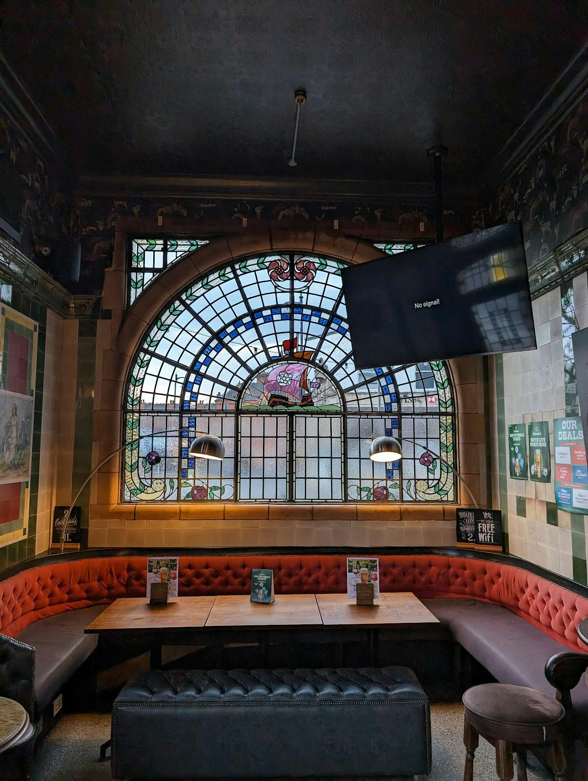 Garden Area at Rose Villa Tavern with stained glass, perfect for events and meetings. - Banner