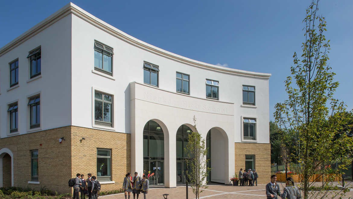 Modern training room with large windows, ideal for meetings and events at Nishkam Centre.