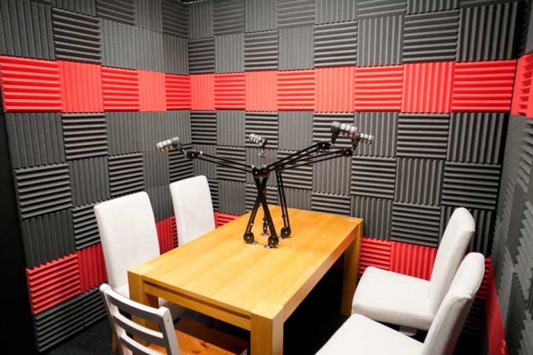 Soundproof meeting room at Base Studios for podcasts and virtual meetings. - Banner