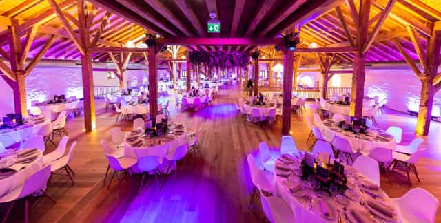 Elegant event space with round tables, ideal for weddings and corporate events.