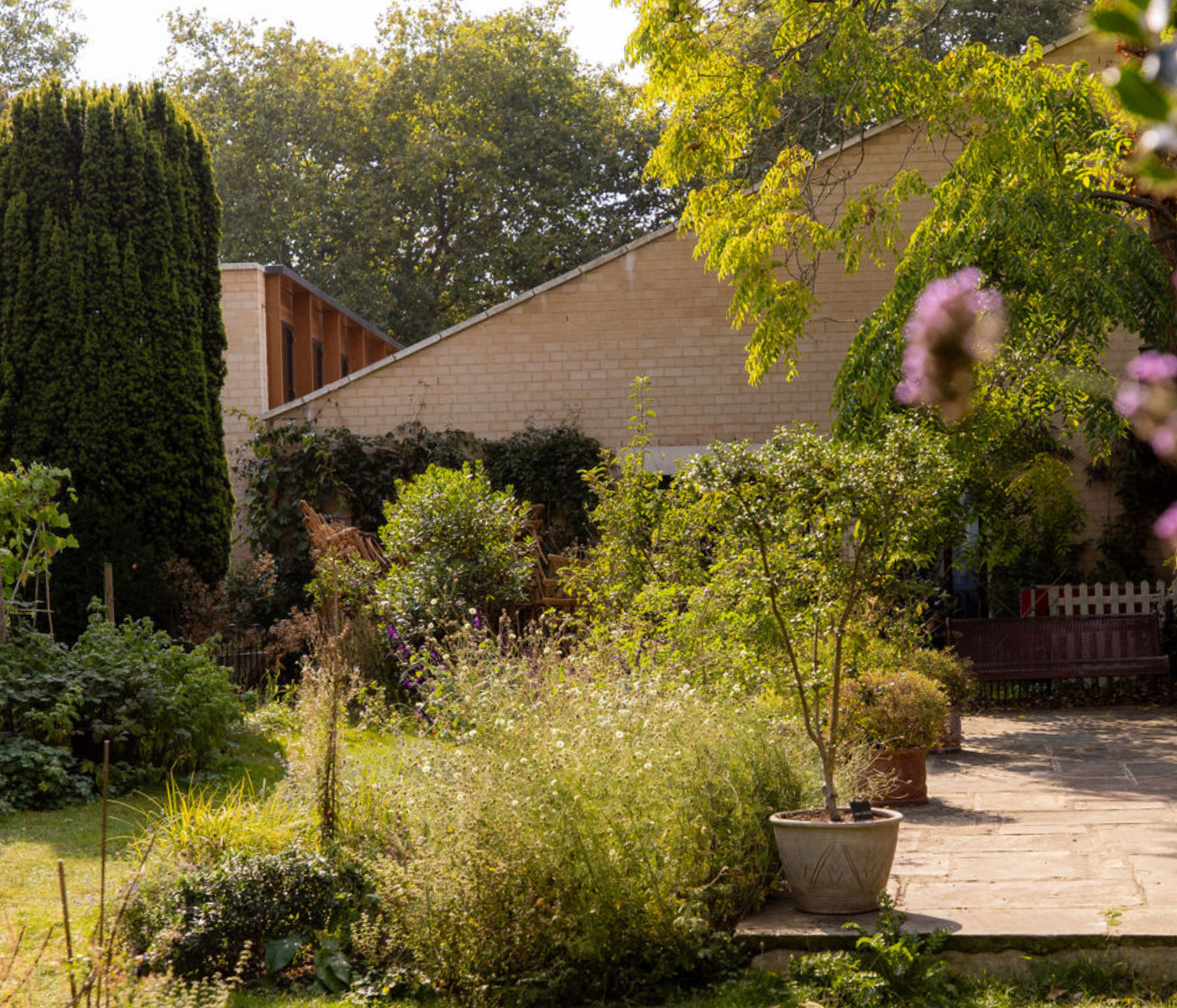 Serene outdoor venue in Sands End with lush greenery for intimate gatherings and events. - Banner