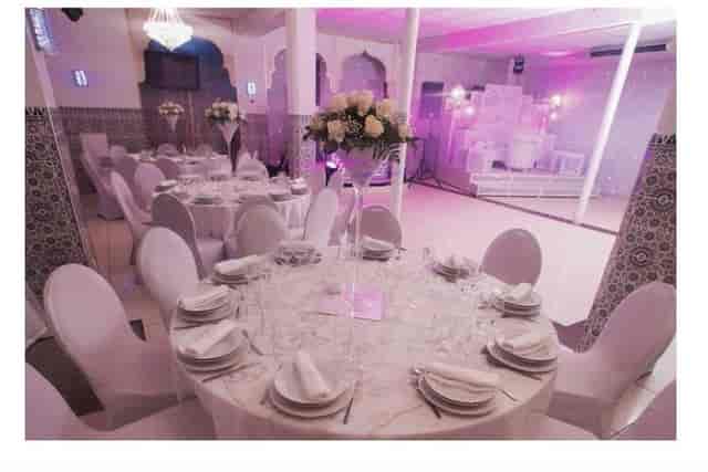Elegant banquet space with floral centerpieces, perfect for weddings and corporate events.
