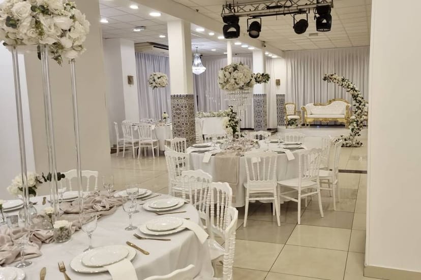 Elegant Cocktail Room setup with white tables, perfect for weddings and formal events.
