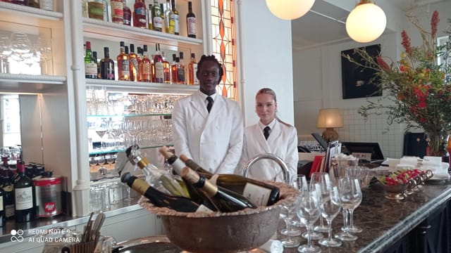 Elegant bar setup with staff at l'Émil, Château Voltaire for a sophisticated event.