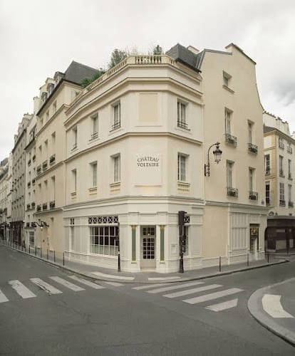 Château Voltaire venue for upscale events with elegant façade and networking potential.