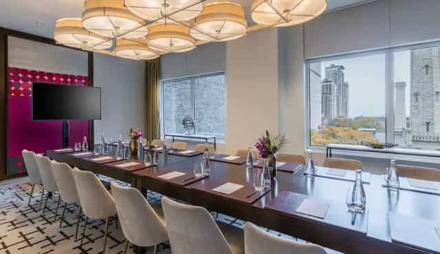 Modern NoMi Private Dining Room with elegant table for professional meetings and events.