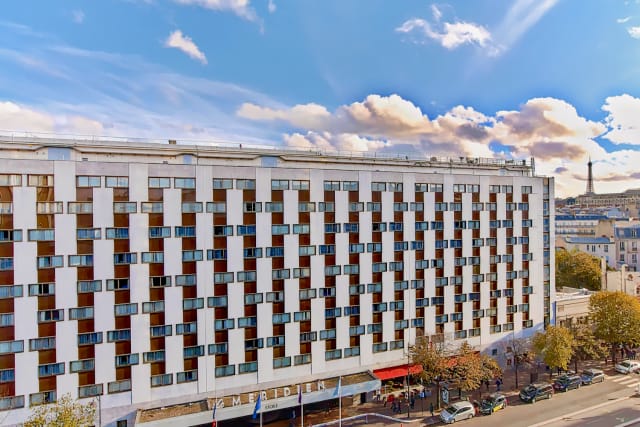 Modern hotel facade at Le Méridien Etoile, ideal for corporate events and meetings.