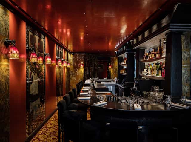 Elegant Paris Gallery restaurant, warm lighting, ideal for private events and networking.