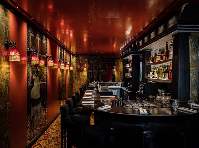 Elegant Paris Gallery restaurant, warm lighting, ideal for private events and networking.