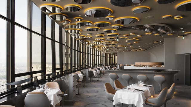 Upscale Ciel de Paris restaurant with stunning views, ideal for corporate events and private meetings.