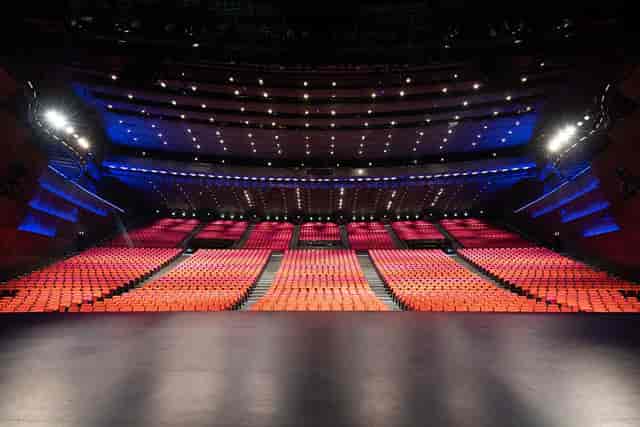 Spacious auditorium with tiered seating at Palais des Congrès, ideal for conferences and performances.