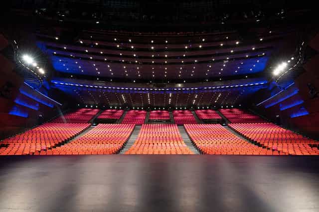 Spacious auditorium with tiered seating at Palais des Congrès, ideal for conferences and performances.