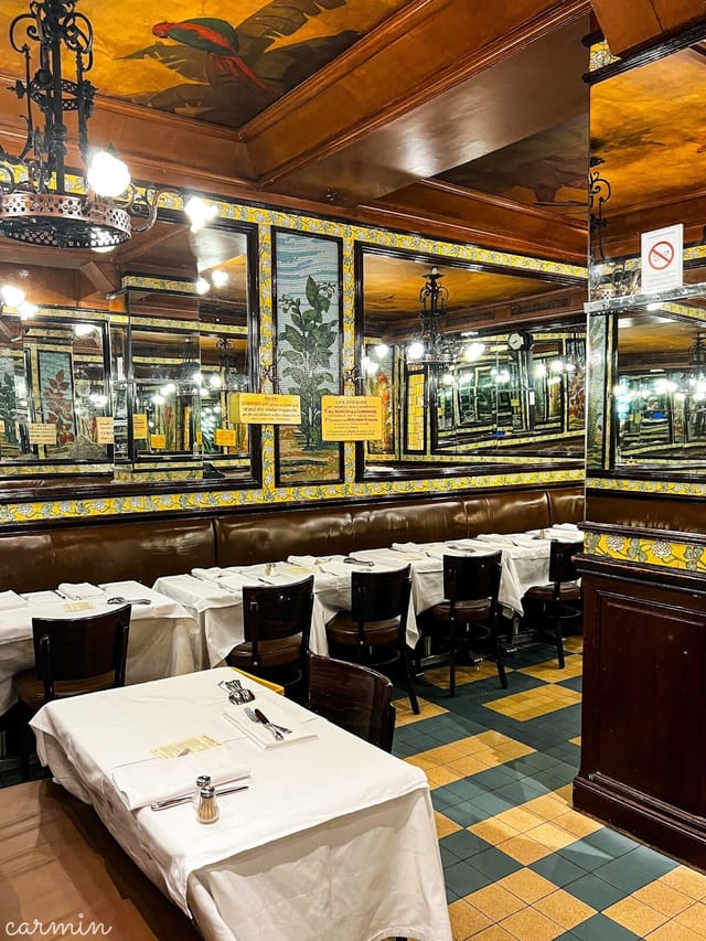 Elegant Brasserie Lipp interior with mirrored walls for private events and gatherings.
