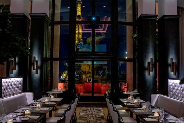 Elegant dining space at Café de l'Homme with Eiffel Tower view, ideal for upscale events.
