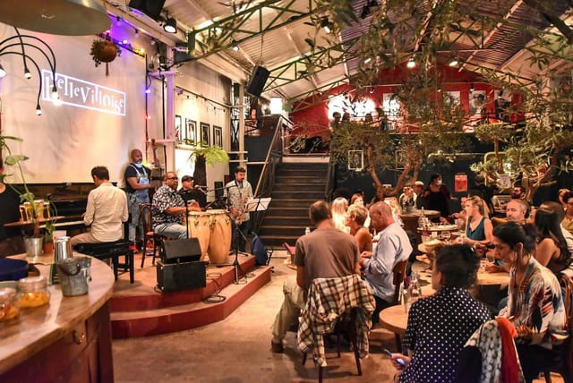 Vibrant La Bellevilloise nightclub with intimate stage for live music events.