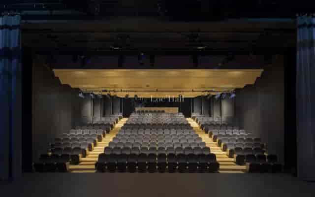 Modern auditorium with tiered seating, ideal for conferences and presentations.
