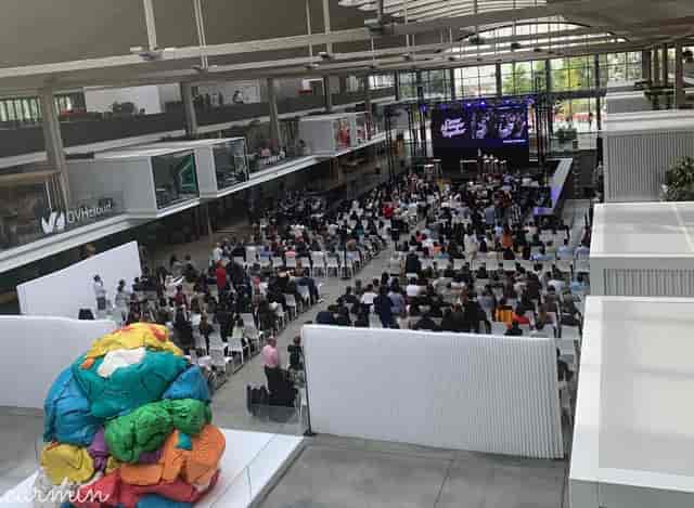 Open Platform event at STATION F with vibrant art installation and engaged audience.