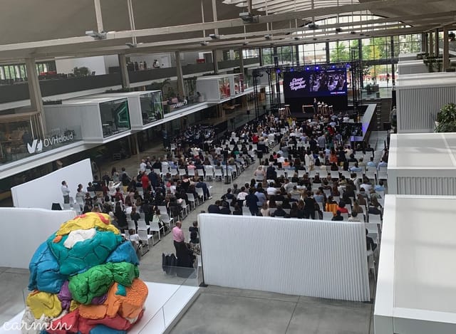Open Platform event at STATION F with vibrant art installation and engaged audience.