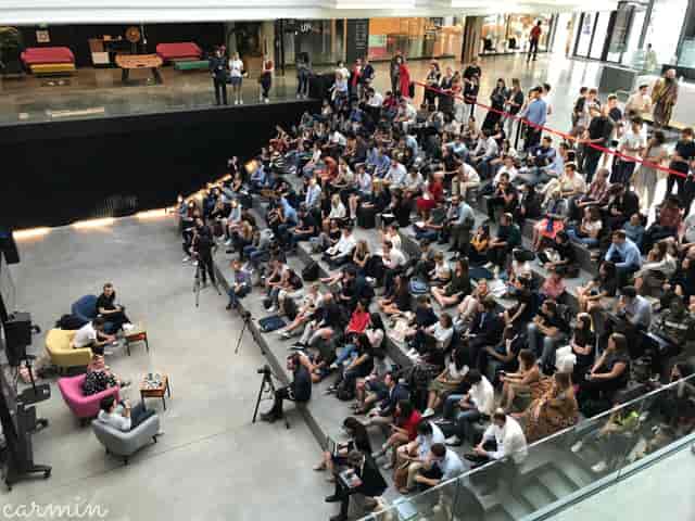 Master Stage at STATION F during a panel discussion with engaged audience and colorful seating.