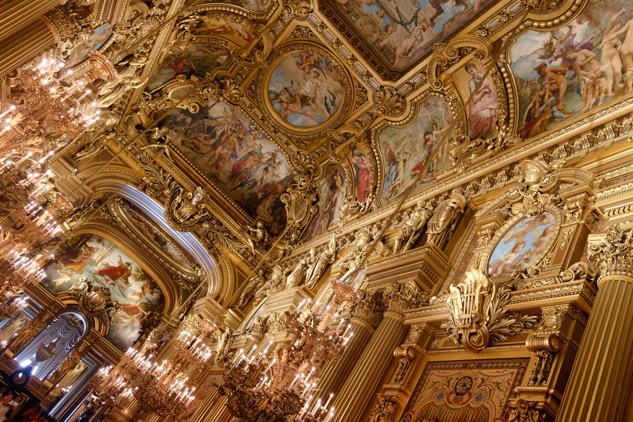 Opulent Le Grand Foyer with intricate ceiling art, perfect for weddings and galas.