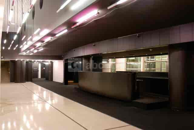 Le Grand Foyer, modern event space with polished floors, ideal for corporate gatherings.