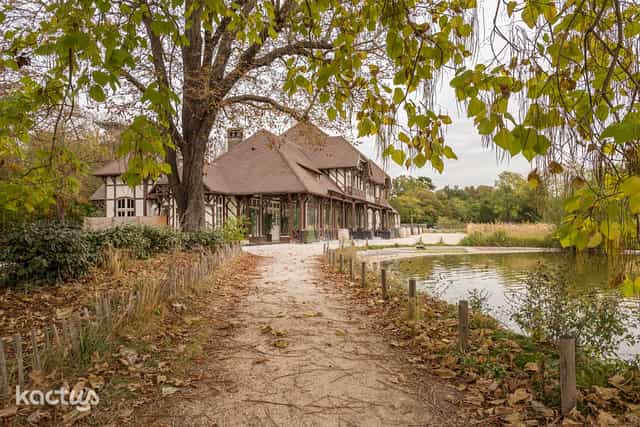 Charming outdoor venue with serene pond, perfect for weddings and corporate retreats.