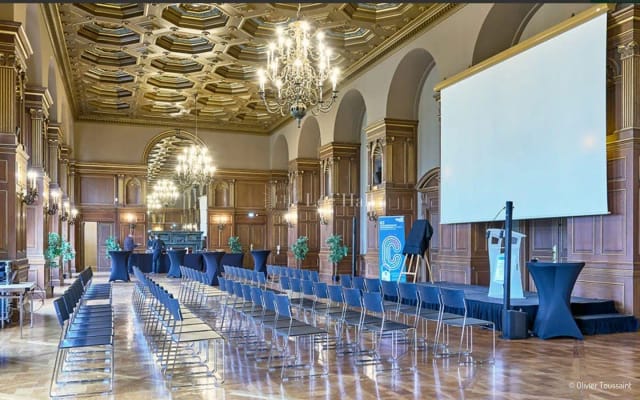 Elegant event space with chandeliers for corporate meetings in Paris.