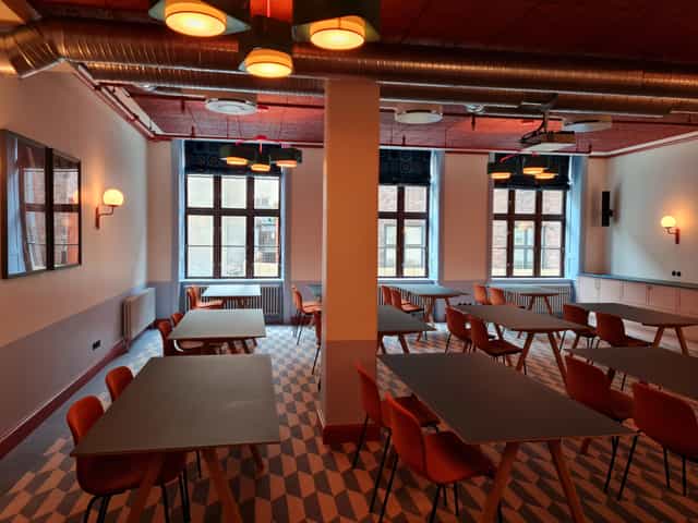 Versatile meeting room with natural light at 25hours Hotel Indre By for workshops.