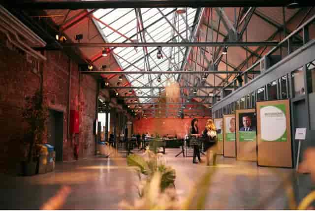Riverside Restaurant & Mezzanine, modern venue with high ceilings for conferences and networking.