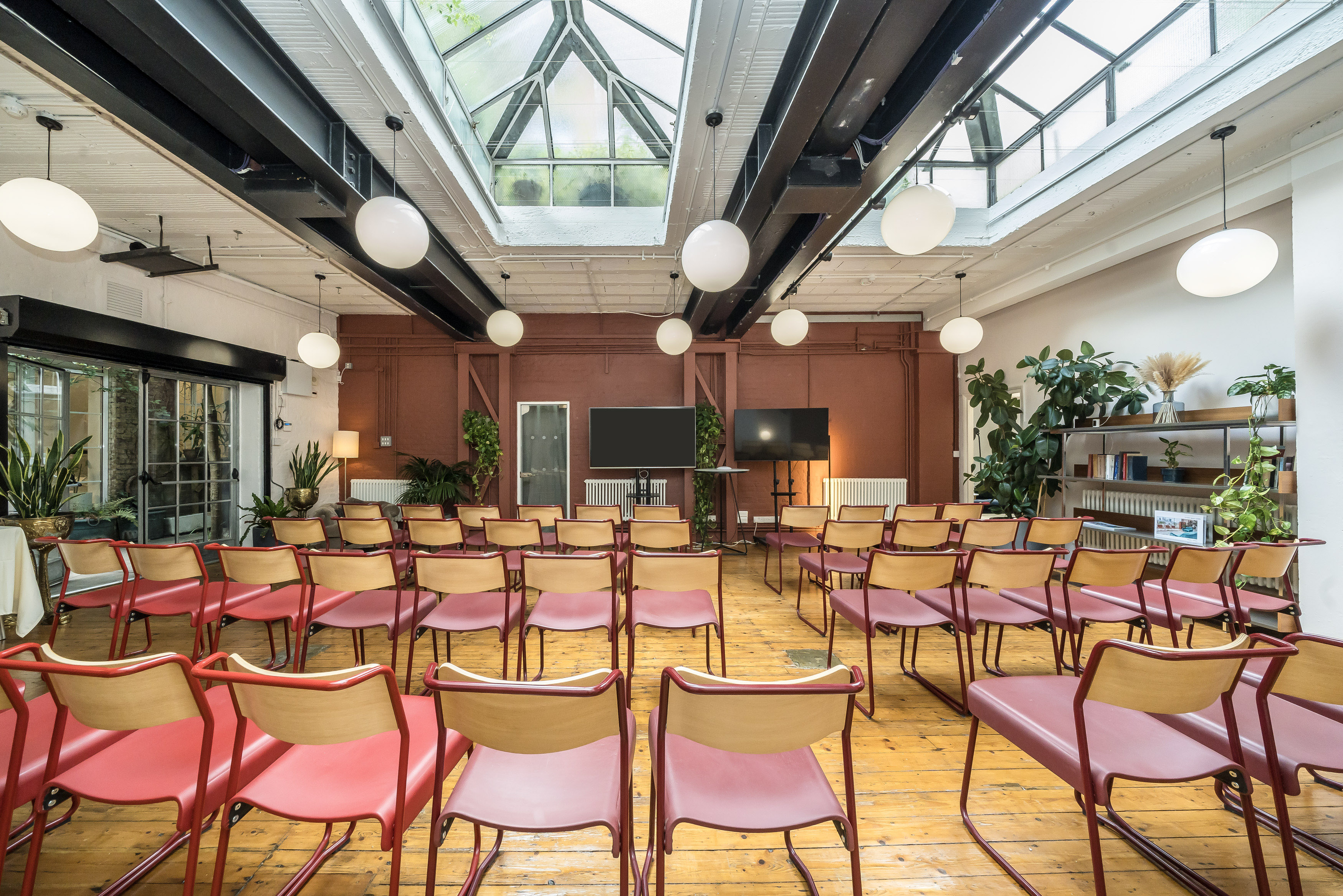 Versatile event space at Menier Playhouse with natural light, ideal for workshops and seminars.